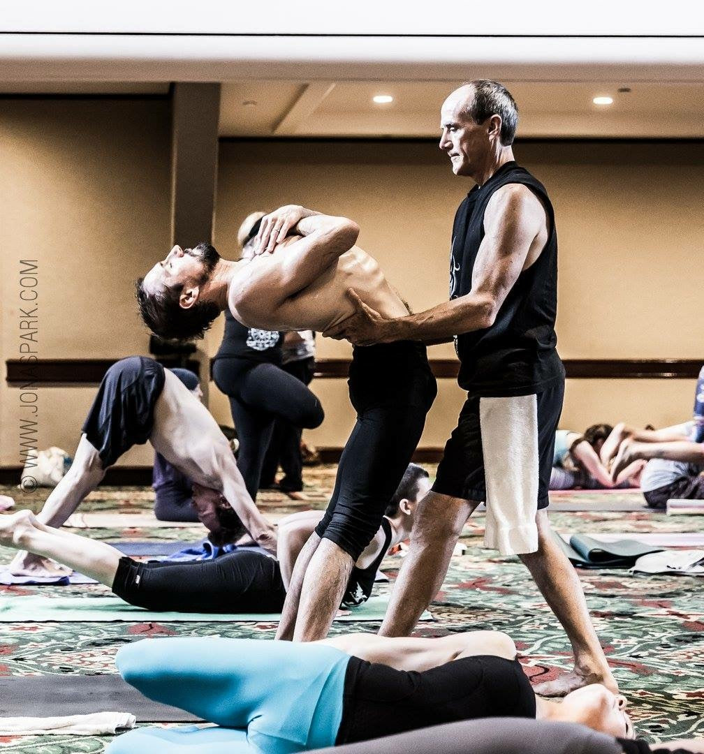 David Swenson – Author of Only Dead Fish Go With The Flow showing a student how to doAshtanga Yoga